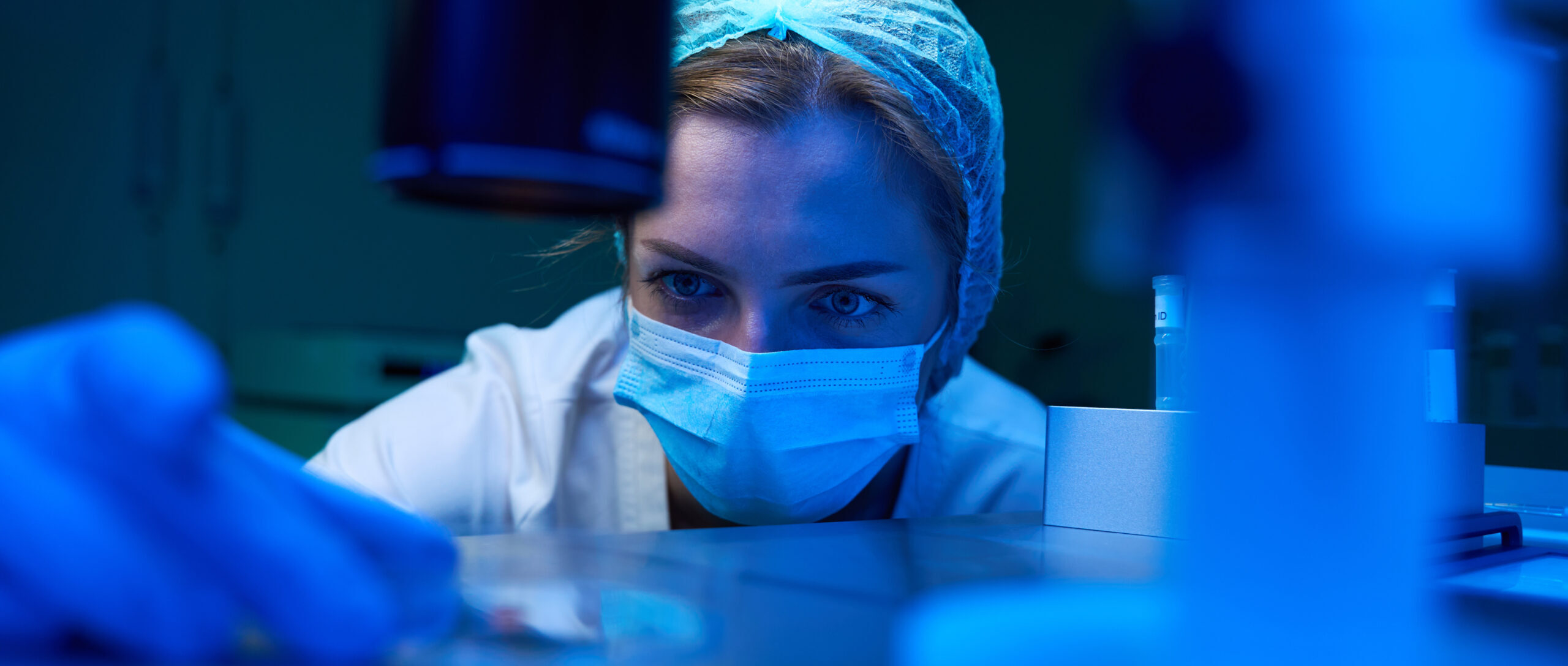 Closeup of an embryologist in lab at a microscope | ICSI with IVF | Arizona Reproductive Medicine Specialists