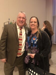 Amber Brewer being presented her DEB USA award
