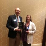 Dr. Moffitt and Amber Brewer showing off their DEB USA awards