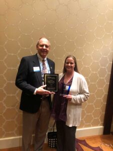 Dr. Moffitt and Amber Brewer showing off their DEB USA awards