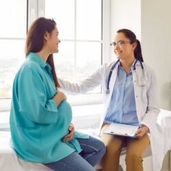 Pregnant woman with doctor | Frozen embryo transfer | Arizona Reproductive Medicine
