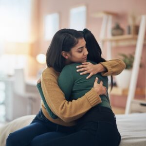 Two women hugging | Free Egg Freezing | Arizona Reproductive Medicine